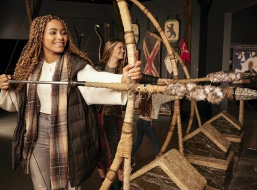 People using interactive arrow exhibition